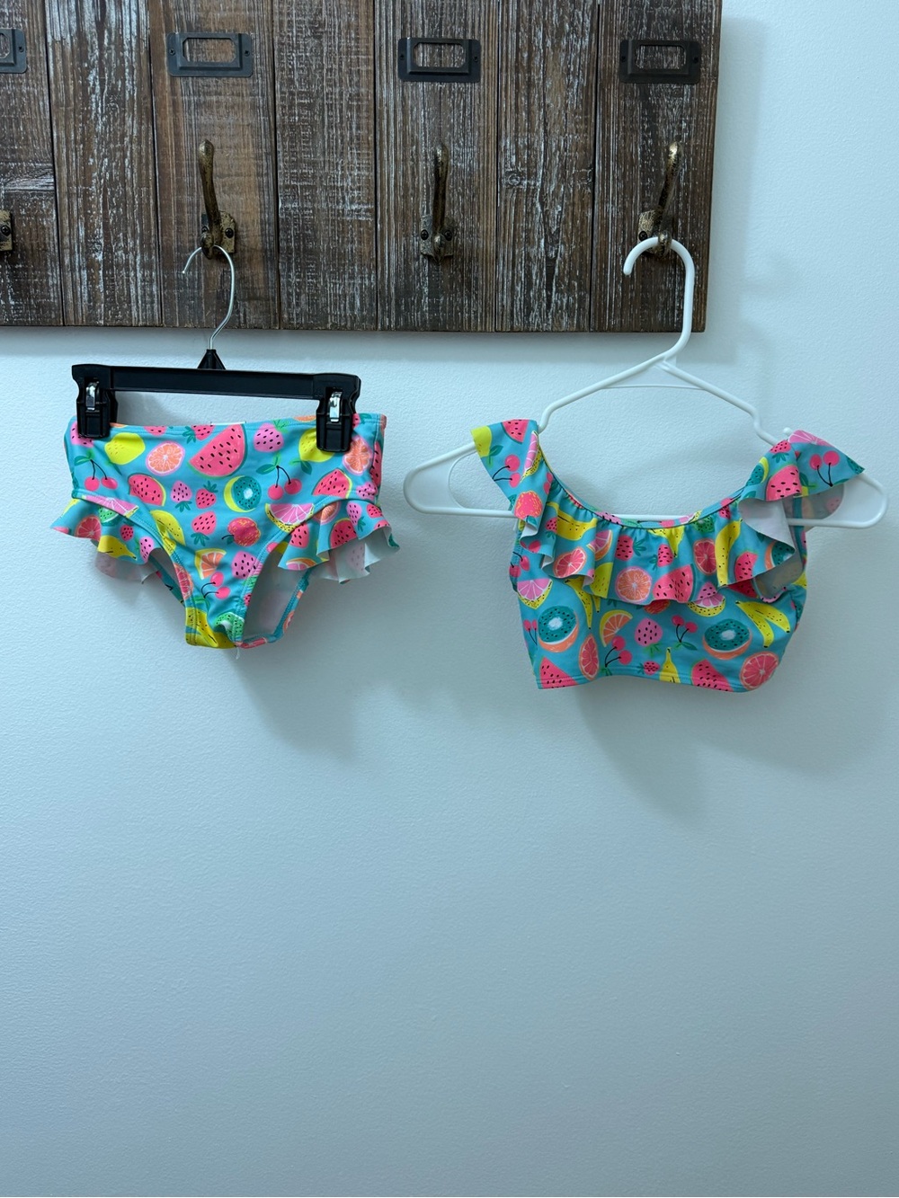 Ruffle Girl brand kids' swimsuit featuring a tropical fruit pattern, size 8.